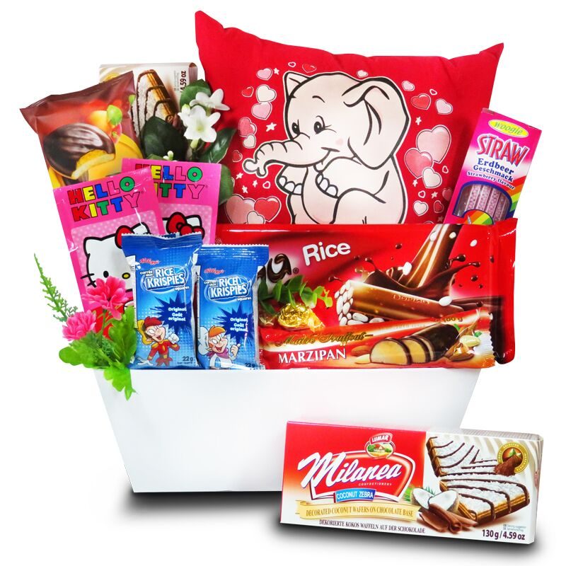 Birthday Gift for Children, glow pillow with chocolates and sweets in a basket.
